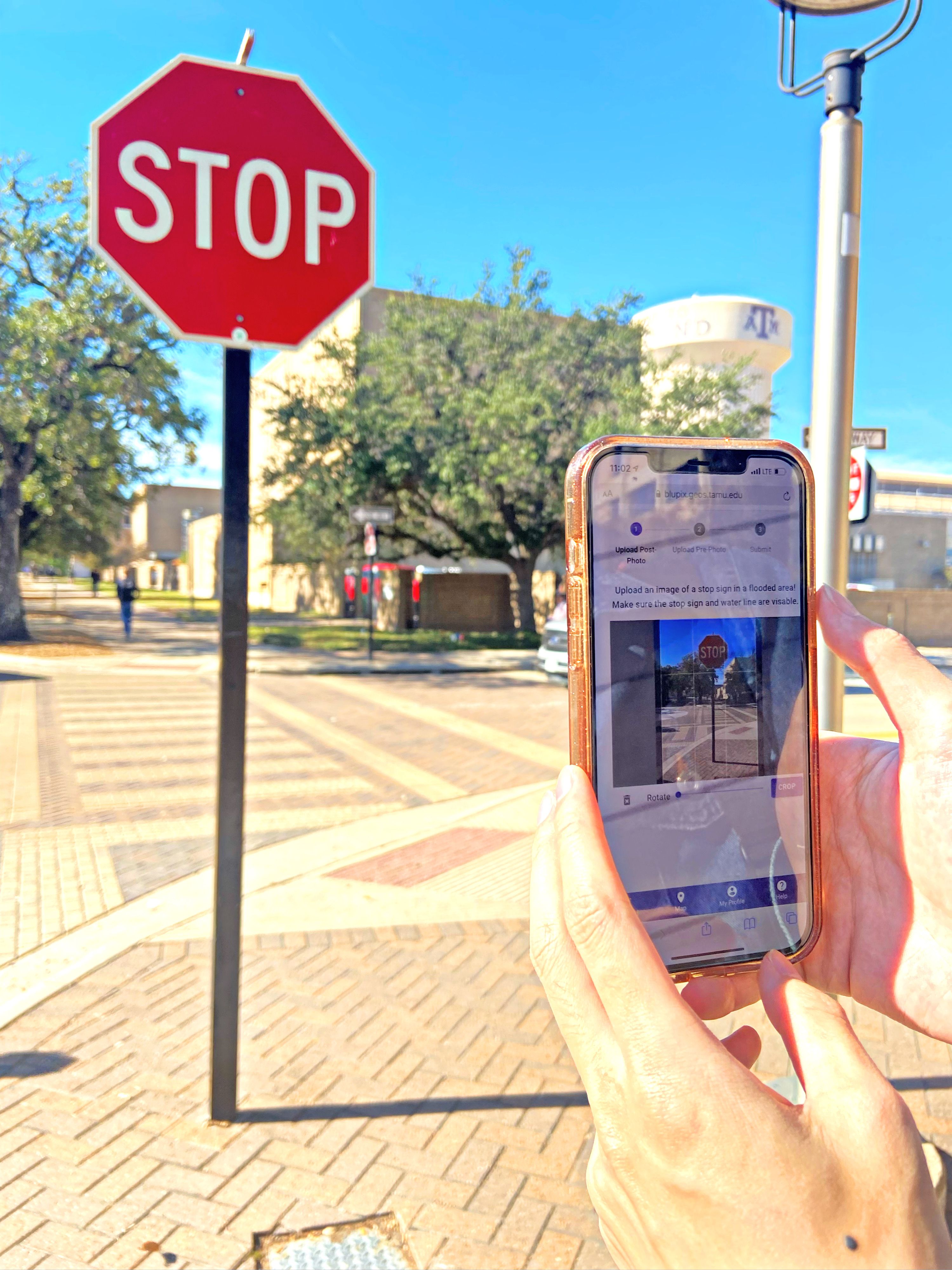 A smart phone taking a photo of a stop sign